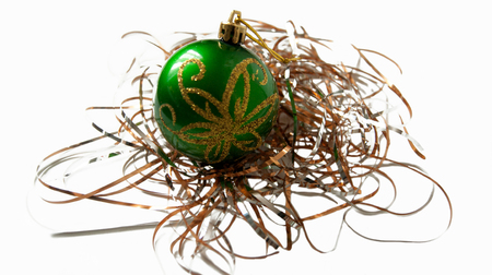 green Christmas ball on garlandの写真素材