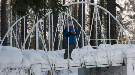 boy on the bridge in the Parkの写真素材