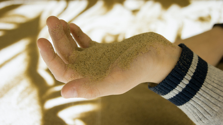 child plays with sandの写真素材