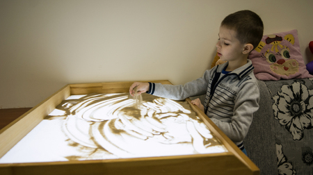 child plays with sandの写真素材