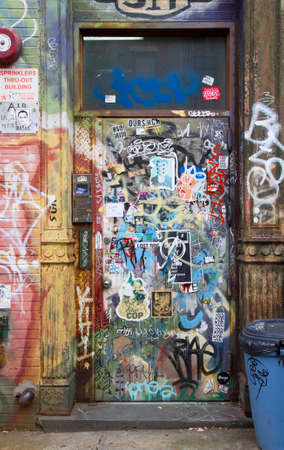 Brooklyn, New York, United States - 17 August 2014 : Tagged door and wall with graffiti in Williamsburg Brooklynのeditorial素材