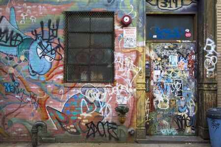Brooklyn, New York, United States - 17 August 2014 : Tagged door and wall with graffiti in Williamsburg Brooklynのeditorial素材
