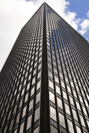 Manhattan, New York, United States - 15 August 2014 : Glass building, skyscraper in midtown, in Manhattan with reflection and blue skyのeditorial素材