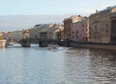 Saint Petersburg, Russia - 03 March 2015: Canal and boat in Saint Petersburg with colorfull building in the back.のeditorial素材