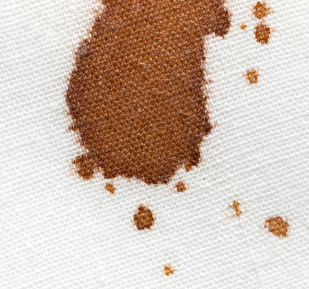 drops of coffee on a white clothの写真素材