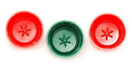 three bottle cap with green and red