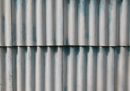 corrugated iron fence blueの写真素材
