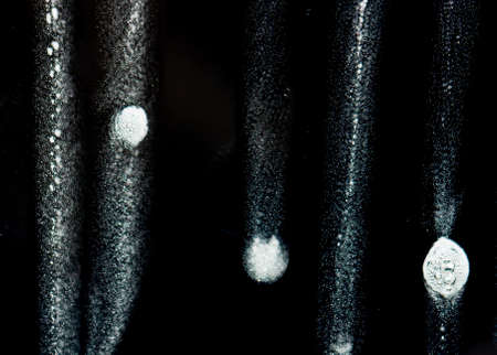 White foam on black glassの写真素材