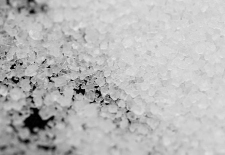 white sugar on a black backgroundの写真素材