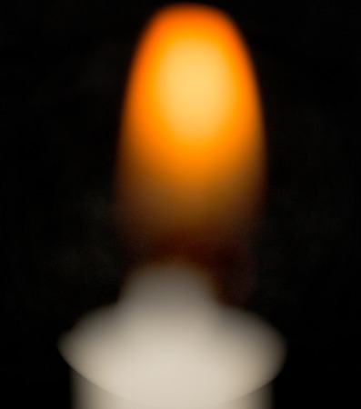candle flame on a black backgroundの写真素材