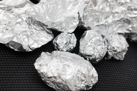 crumpled foil on a black background