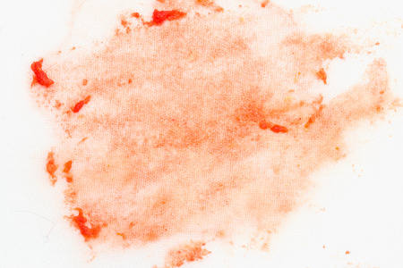stain of ketchup on a white materialの写真素材