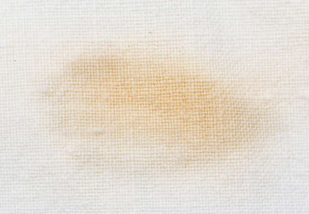 brown stain on the white materialの写真素材