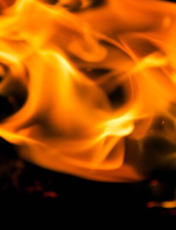 Fire flames on a black backgroundの写真素材