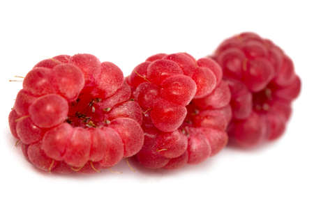 ripe raspberries on a white background
