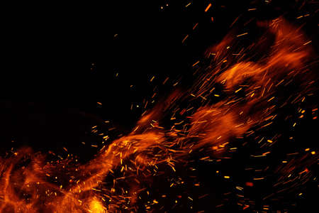 fire flames with sparks on a black backgroundの写真素材
