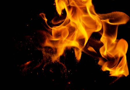 fire flames with sparks on a black backgroundの写真素材