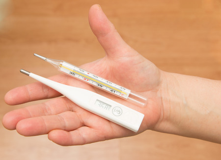 thermometer in hand