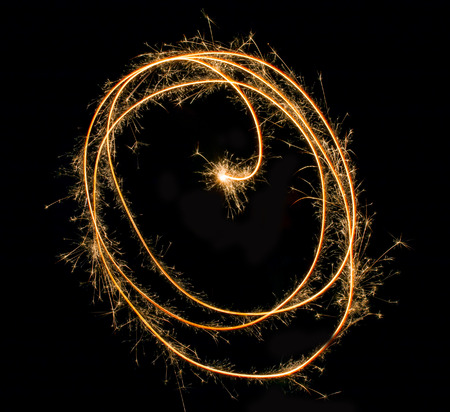sparks of fire on a black backgroundの写真素材