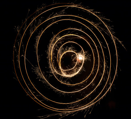 sparks of fire on a black backgroundの写真素材