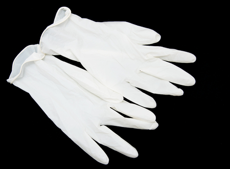 medical gloves on black background