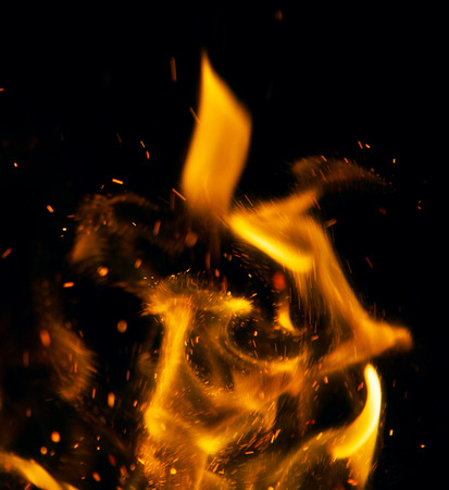 fire flames with sparks on a black backgroundの写真素材