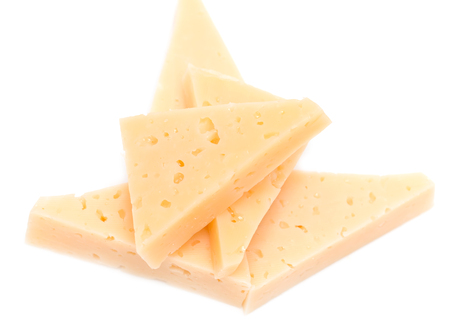 yellow solid cheese pieces on the white backgroundの写真素材