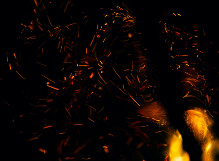 fire flames with sparks on a black backgroundの写真素材