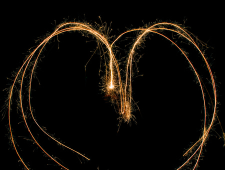 sparks of fire on a black backgroundの写真素材