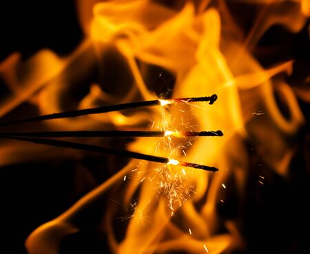 fire flames with sparks on a black backgroundの写真素材