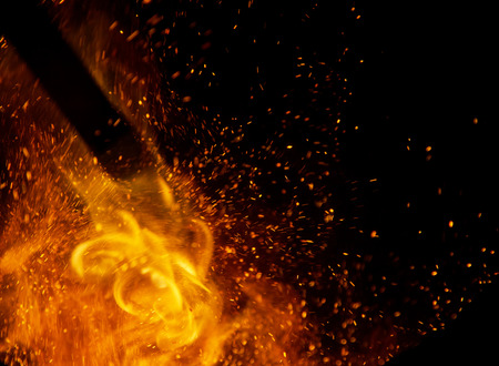 fire flames with sparks on a black backgroundの写真素材