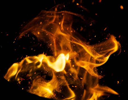 Flame of fire with sparks on a black background