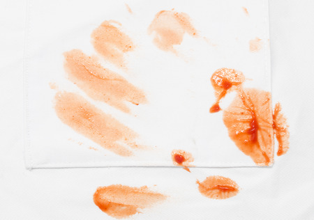 stains from ketchup on white materialの写真素材