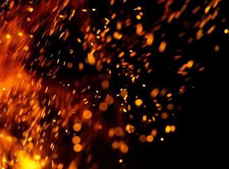 Flame of fire with sparks on a black background