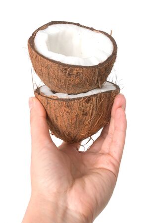 Halves of coconut on white backgroundの写真素材