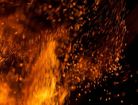 Flame of fire with sparks on a black background