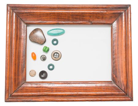 different buttons in a wooden frameの写真素材