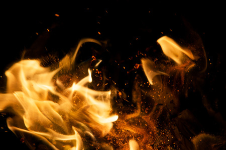 fire flames with sparks on a black backgroundの写真素材