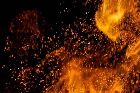 Flame of fire with sparks on a black background