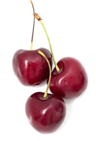 ripe red cherry on a white backgroundの写真素材