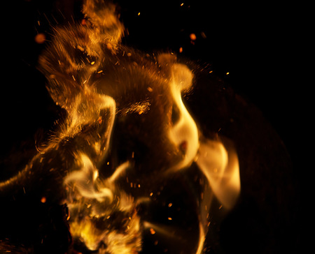 fire flames with sparks on a black backgroundの写真素材