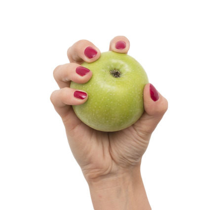 green apple in her handの写真素材