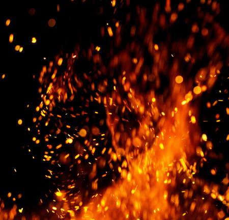 Flame of fire with sparks on a black background