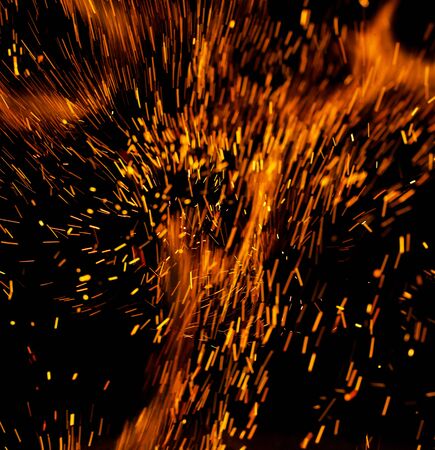 flame of fire with sparks on a black backgroundの写真素材