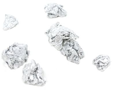 crumpled foil on a white backgroundの写真素材