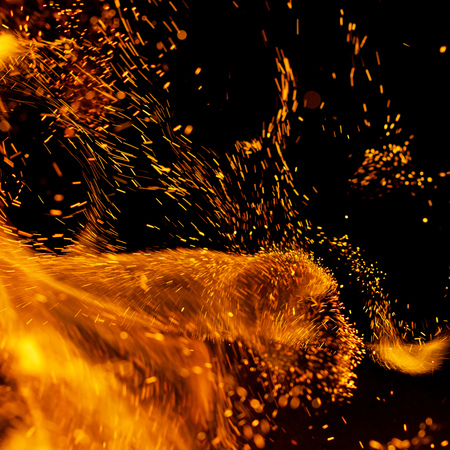 flame of fire with sparks on a black background