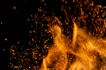 Flame of fire with sparks on a black background