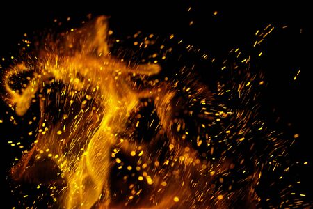 Flame of fire with sparks on a black background