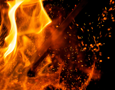 flame of fire with sparks on a black backgroundの写真素材