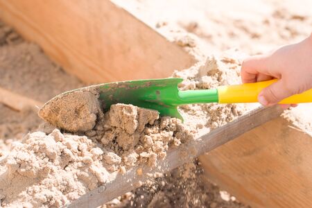 child's hand with sandの写真素材